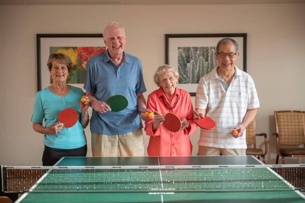 Residents enjoying a friendly game of table tennis