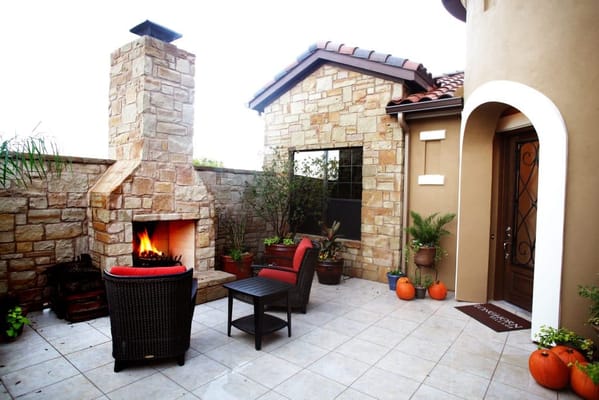Cozy outdoor seating area with a fireplace