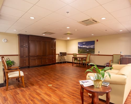 Bright common area with comfortable seating and plants