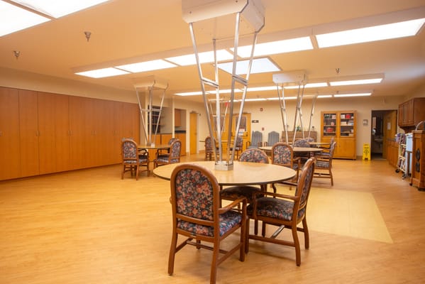 Bright interior common area with dining tables