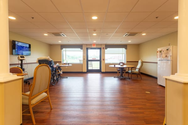 Bright common area with tables and chairs