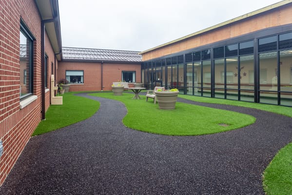 Pathway leading through a well-maintained outdoor garden area