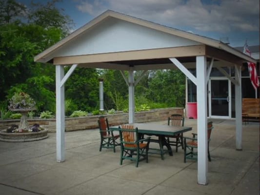 Outdoor sitting area with tables and chairs