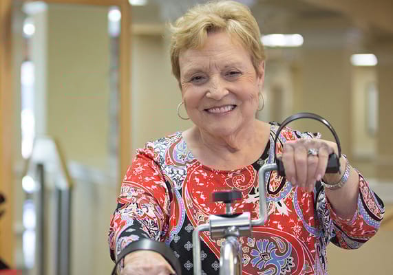 Resident enjoying an activity with a smile