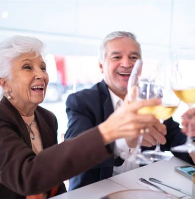 Residents toasting with drinks at a celebration