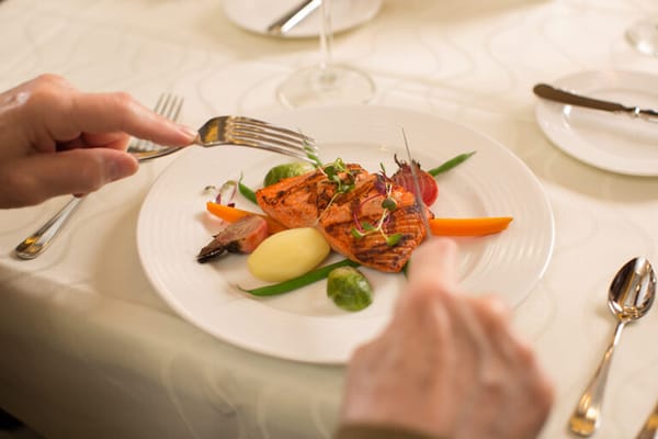 A beautifully plated meal in a dining room setting