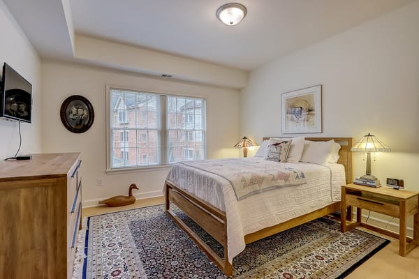 Brightly decorated private resident bedroom with natural light