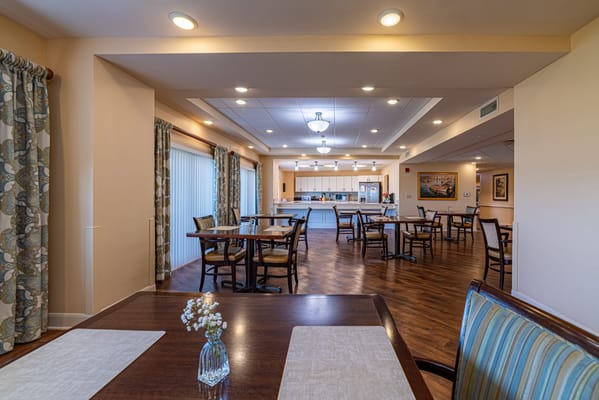 Bright dining area with tables and chairs