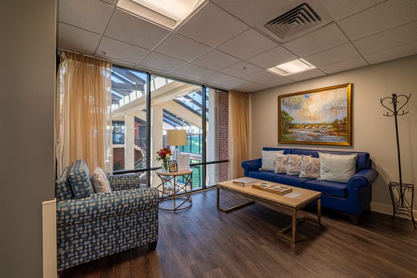 Bright, inviting common area with seating and artwork