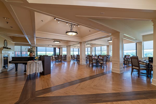 Bright dining area with tables and chairs