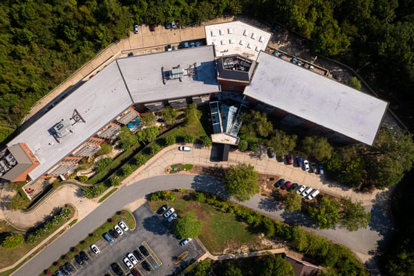 Aerial view of a senior living facility surrounded by trees