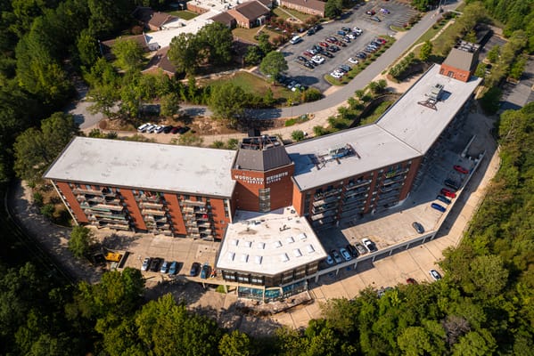 Aerial view of a senior living facility with parking lot