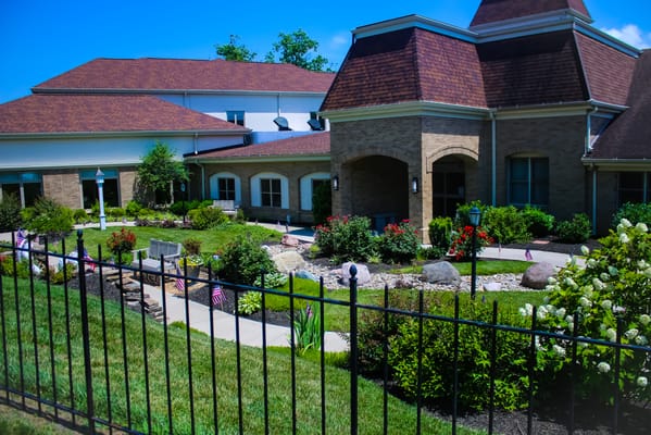 Exterior view of a nursing home with landscaped gardens