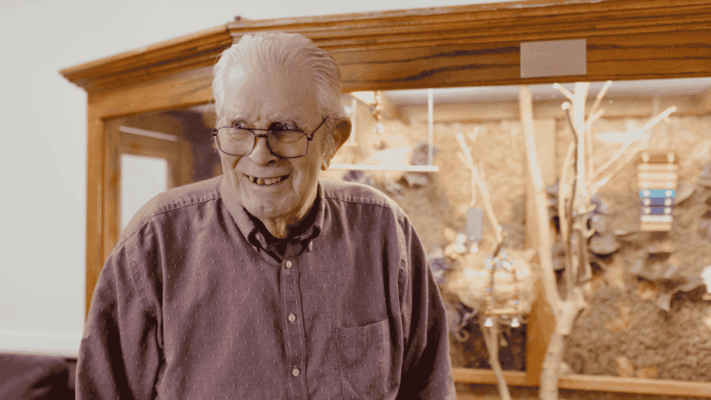 A happy resident in an interior setting