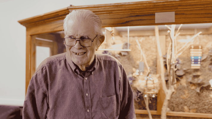 A happy resident in an interior setting