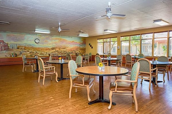 Bright dining room with tables and chairs
