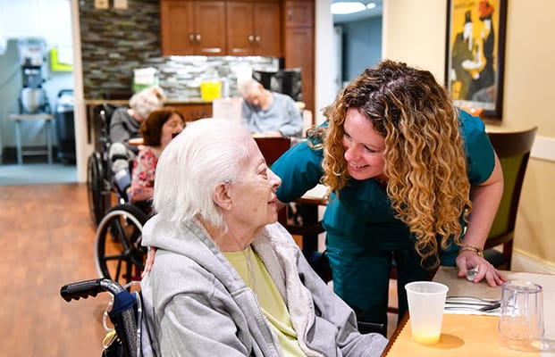 Staff engaging with a resident in a common area