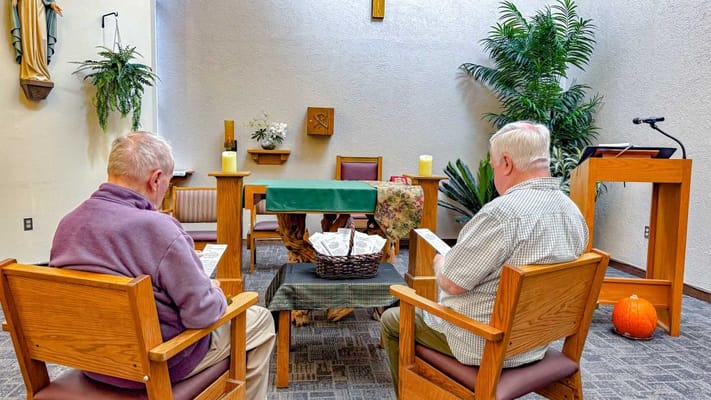 Two residents in a serene chapel setting