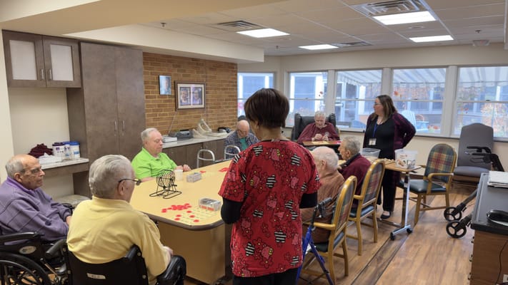 Residents engaging in an activity with staff supervision