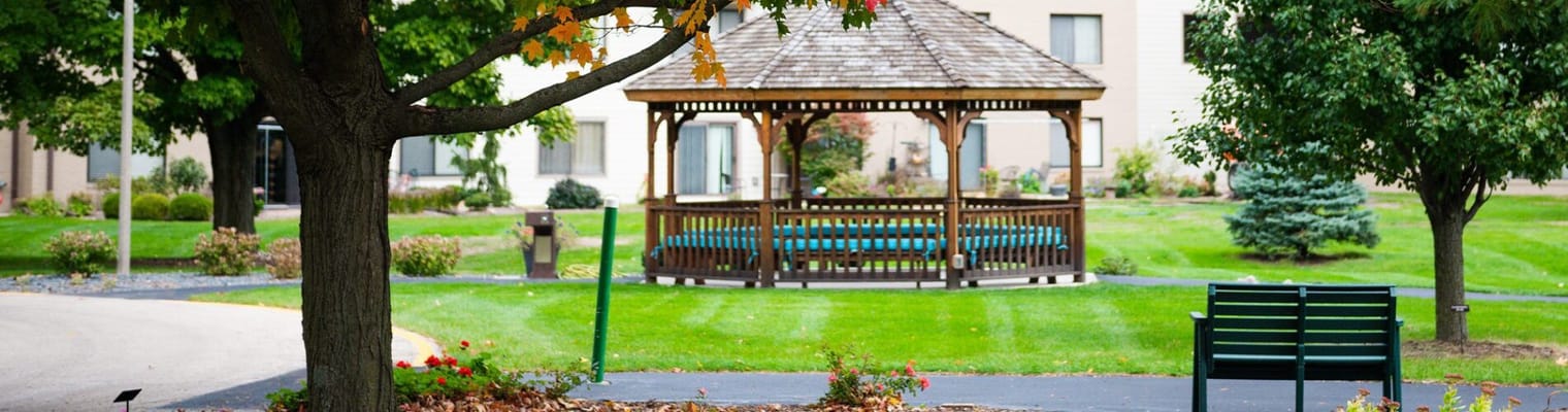 A gazebo in a landscaped outdoor area