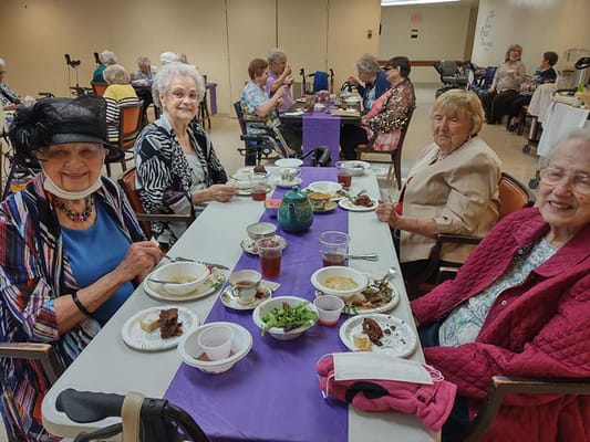 Residents enjoying a meal in a dining area