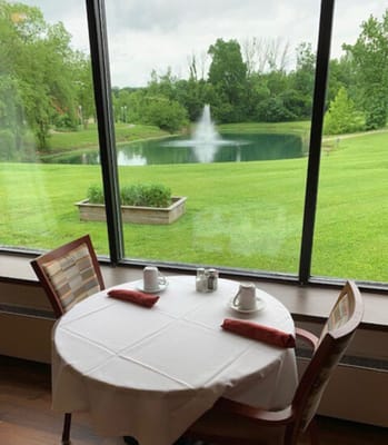 Table set for dining with a view of the garden