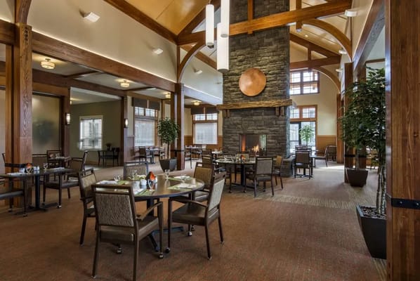 Dining area with tables and a fireplace