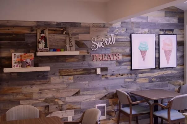 Cozy common area with decorative wall and seating