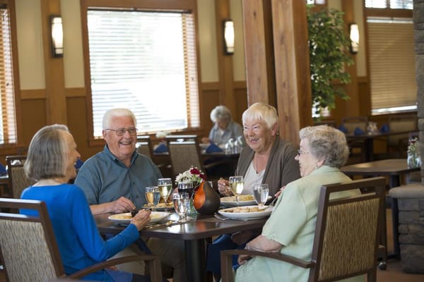 Residents enjoying a meal in the dining room