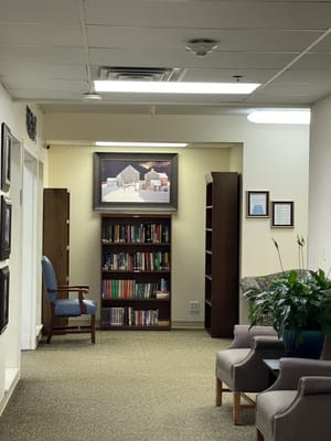 Interior hallway with bookshelves and seating