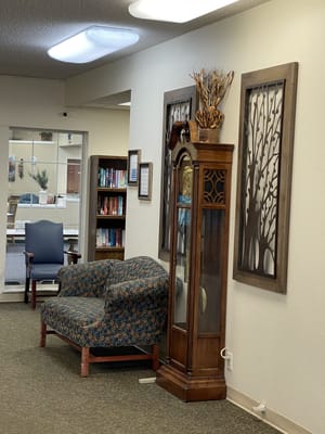 Cozy interior lobby with seating and bookshelves