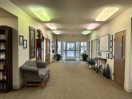 Interior hallway with seating and plants