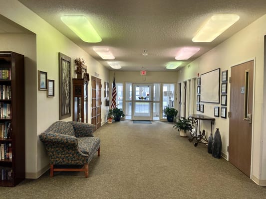 Interior hallway with seating and plants