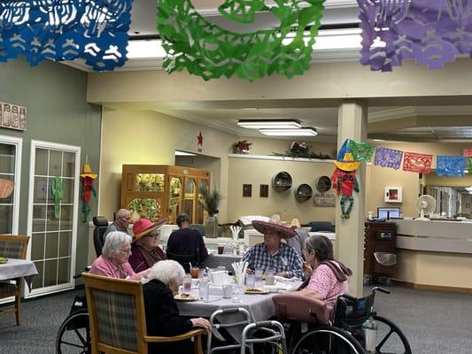 Residents enjoying a meal in the dining room