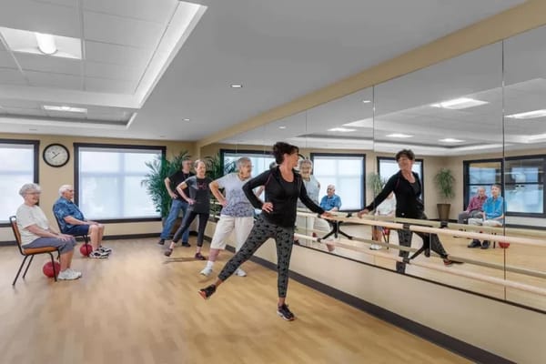 Seniors participating in a dance class in a studio