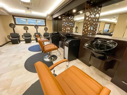 Bright hair salon area with modern styling chairs