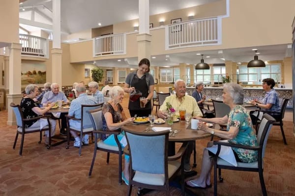 Residents enjoying a meal in the dining room