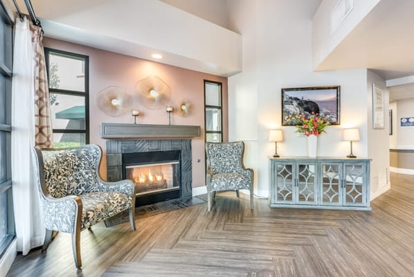 Cozy common area with a fireplace and seating