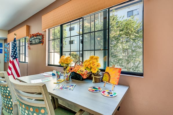 Bright activity space with art supplies and flowers