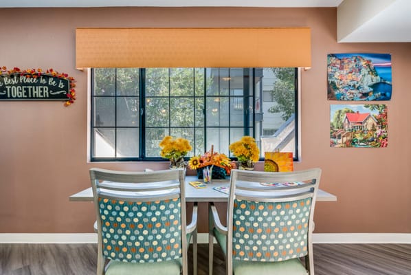 Brightly decorated dining area with flowers