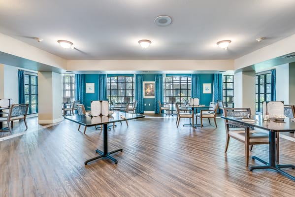 Bright dining room with tables and chairs