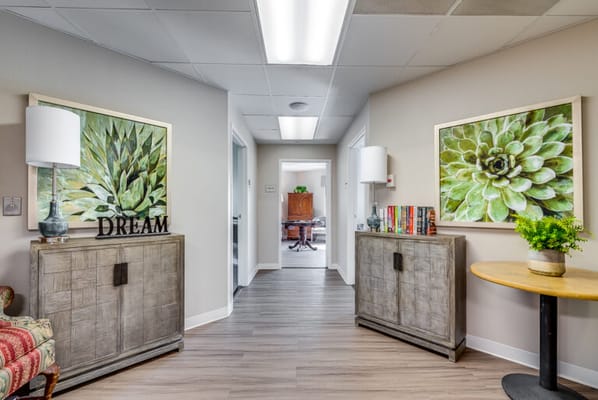 Interior hallway with decorative plants and furniture