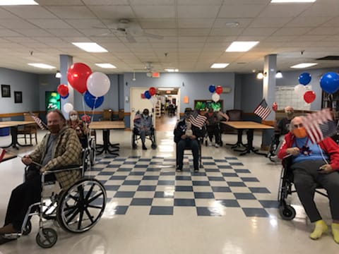 Residents celebrating with decorations in an activity room
