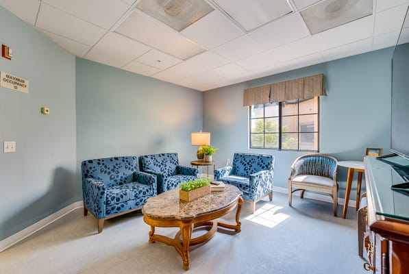 Bright common area with comfortable seating and natural light