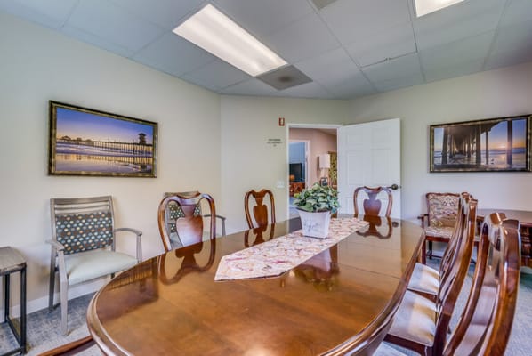 Interior dining area with a large table and chairs
