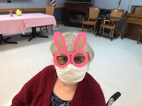 Resident wearing bunny glasses in a common area