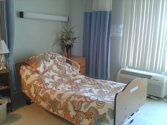 Cozy private resident room with floral bedding