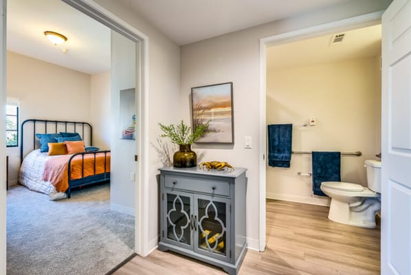 Bright interior of a private resident room with bathroom