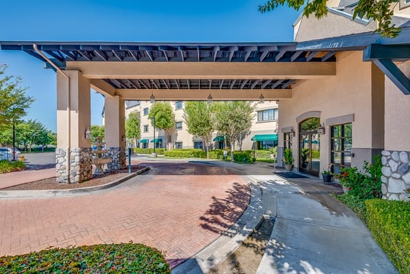 Entrance of a senior living facility with a covered awning