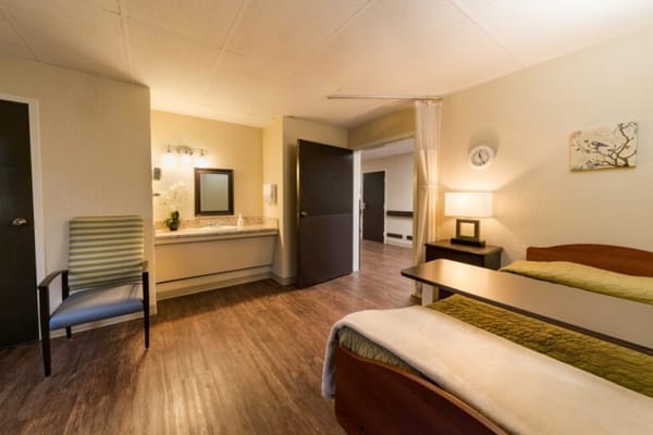 Bright and airy resident room with furnishings